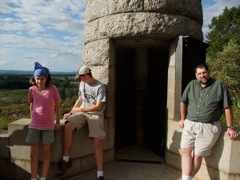 Elizabeth, Rob, and Ethan on a monument on little round top